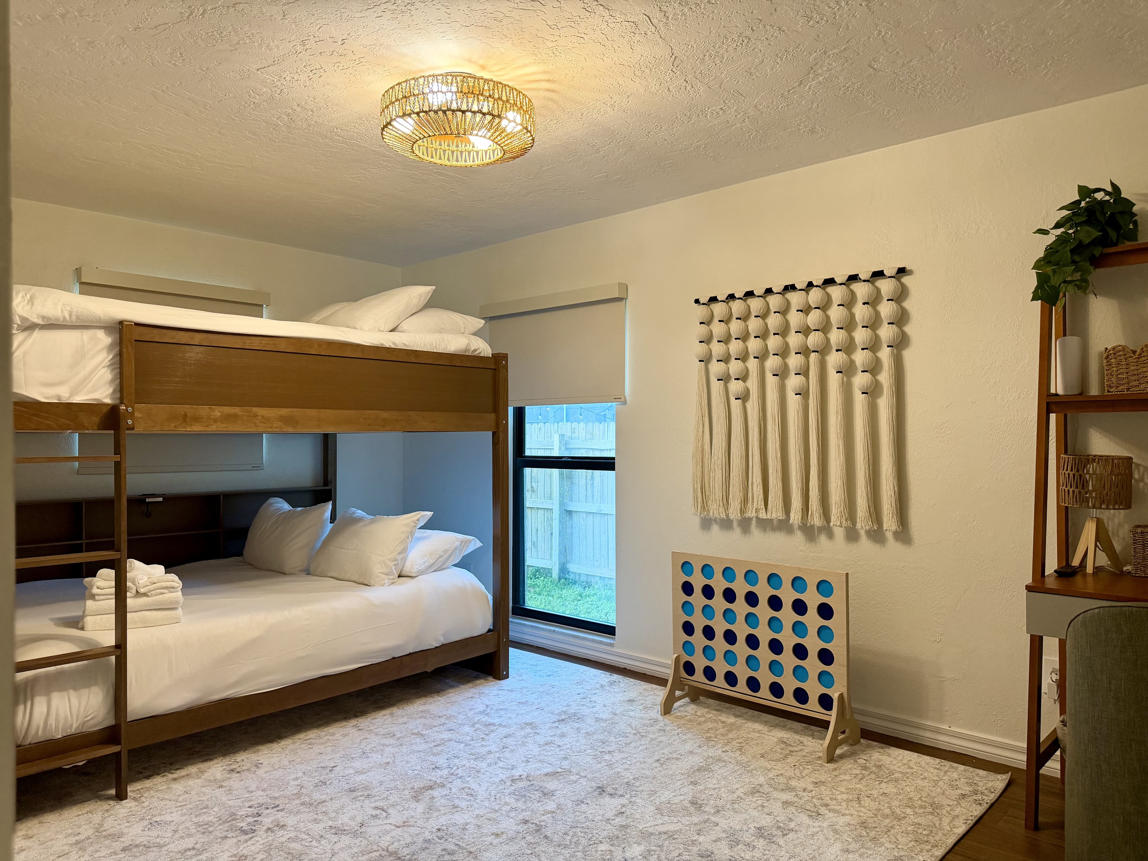 bunk room with macrame and games