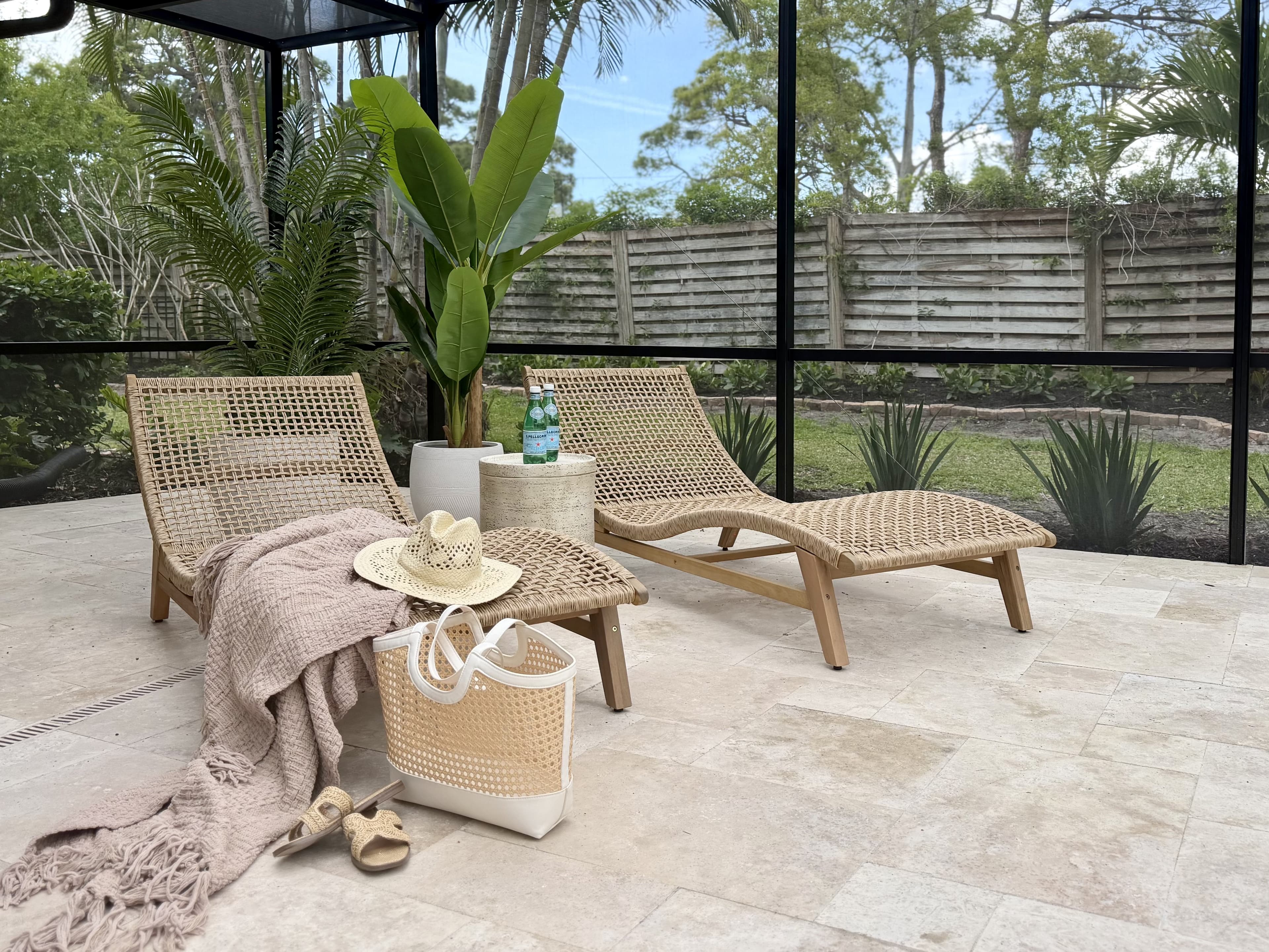 styled poolside loungers with sun hat